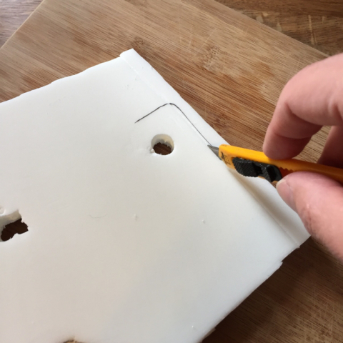 Cutting to fit inside the helmet sides.