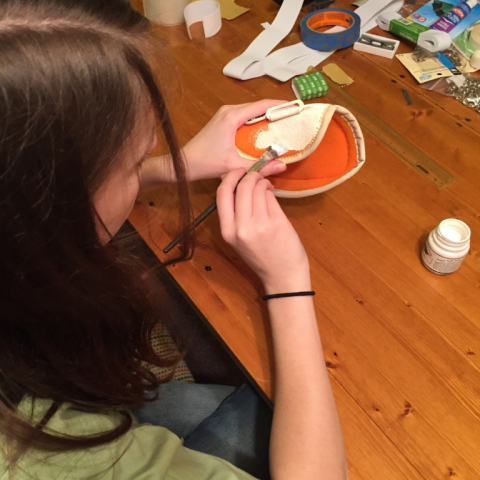 My daughter Maddy working on the left arm pad.