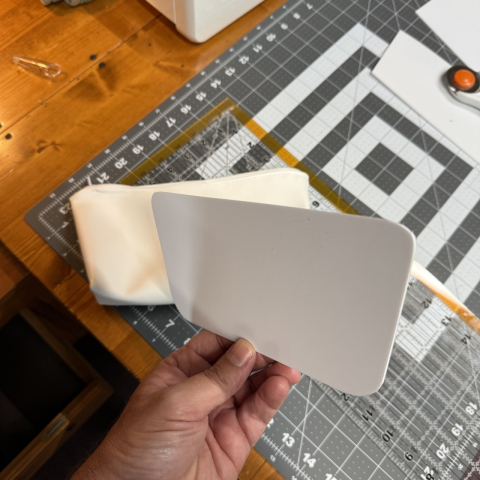 Used a piece of rigid vinyl from a Sterilite trash can to make a backing plate.