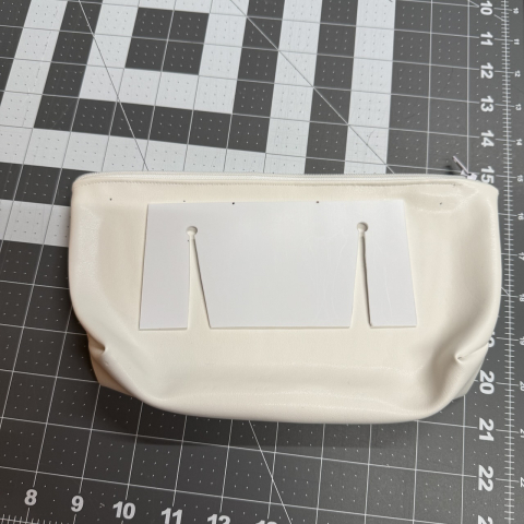 Cut a belt clip to super-glue on the outside against the inner rigid plate.