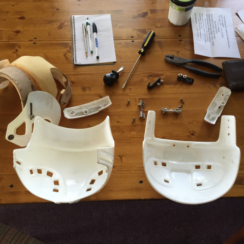 Disassembled. I used a heat gun to remove the glued-in padding.