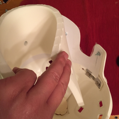 And finally, remove tape backing from right ear and press padding into place.