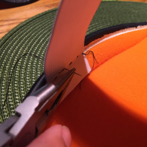 Sewing on the elastic arm straps.